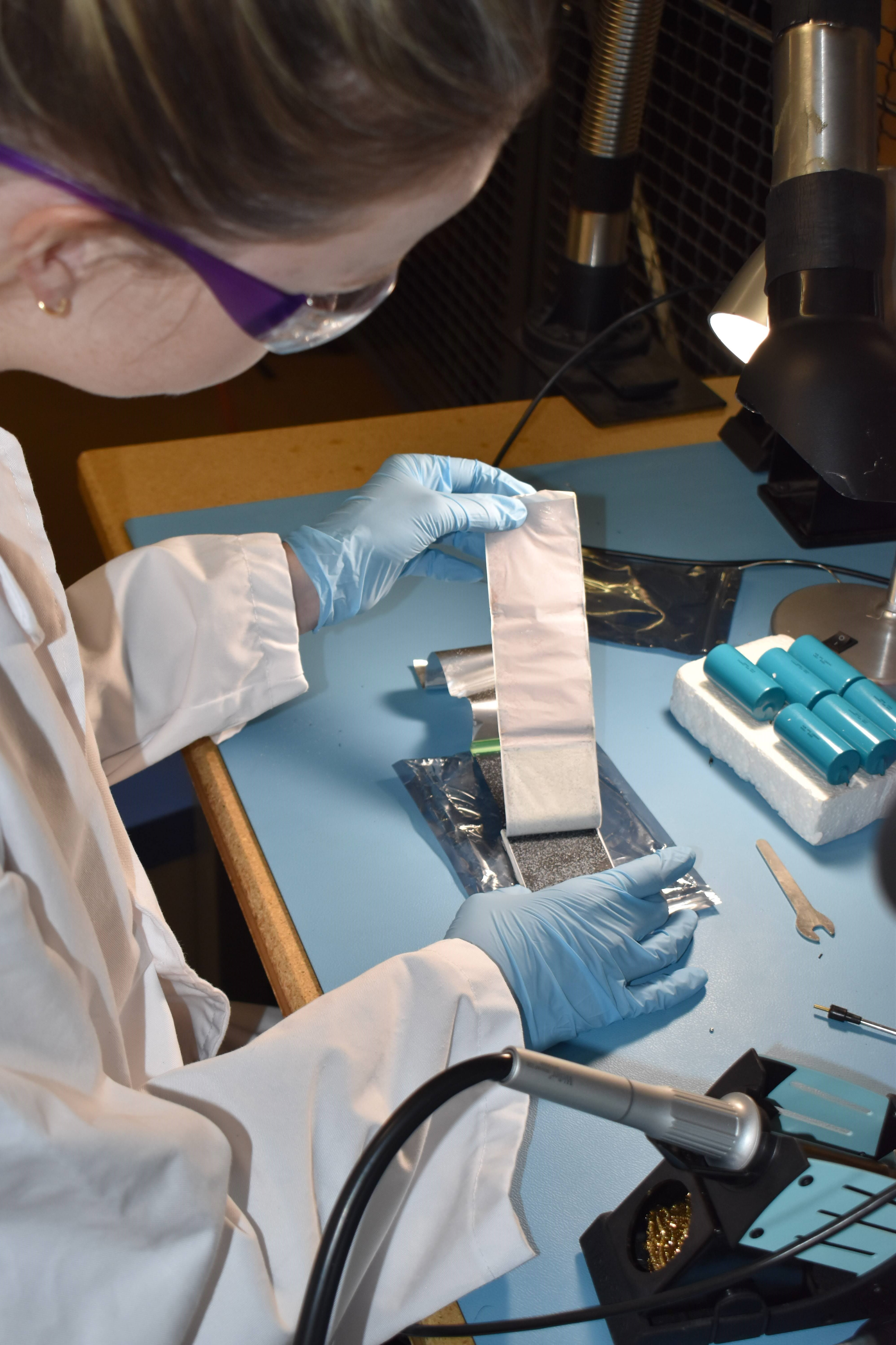 Lab technician preparing a battery sample